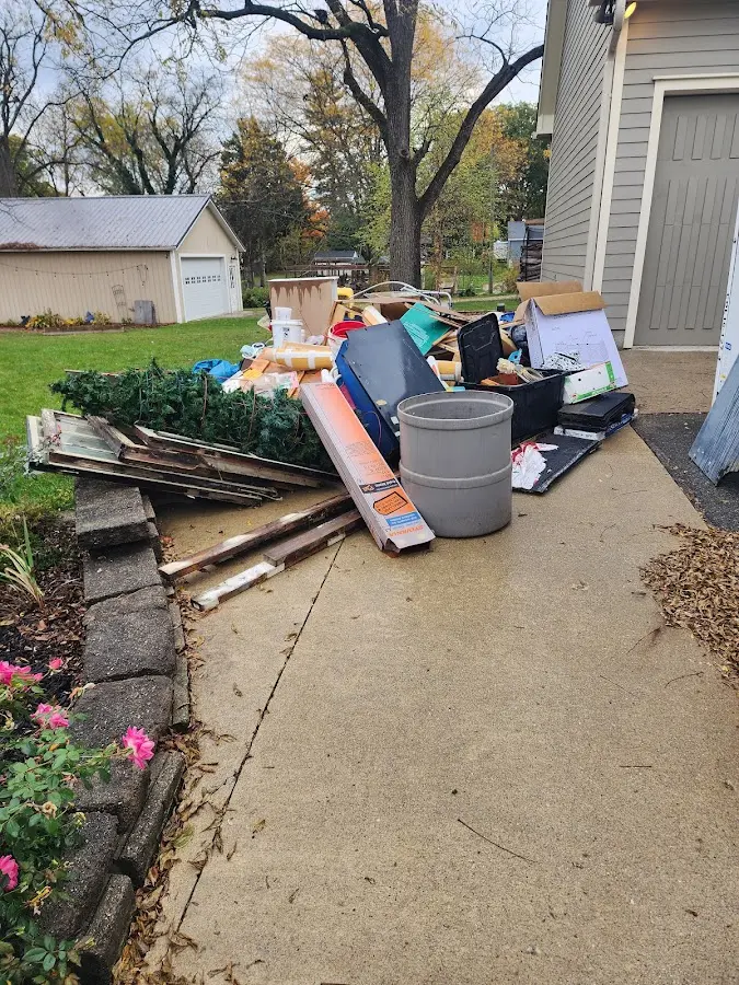 Dumpster being loaded with debris for 30 Yard Dumpster Rental in Midland